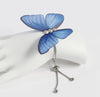a blue umbrella hanging from a white wall 